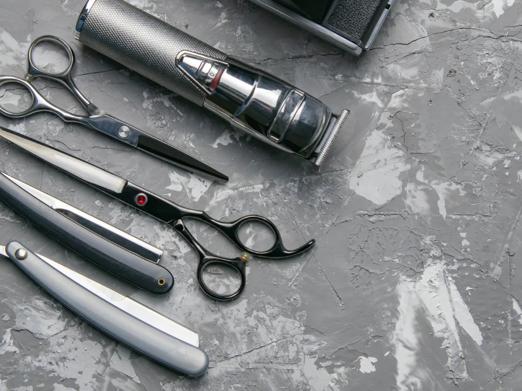 Stack of fresh black towels ready for body grooming at Project Hairway Dubai