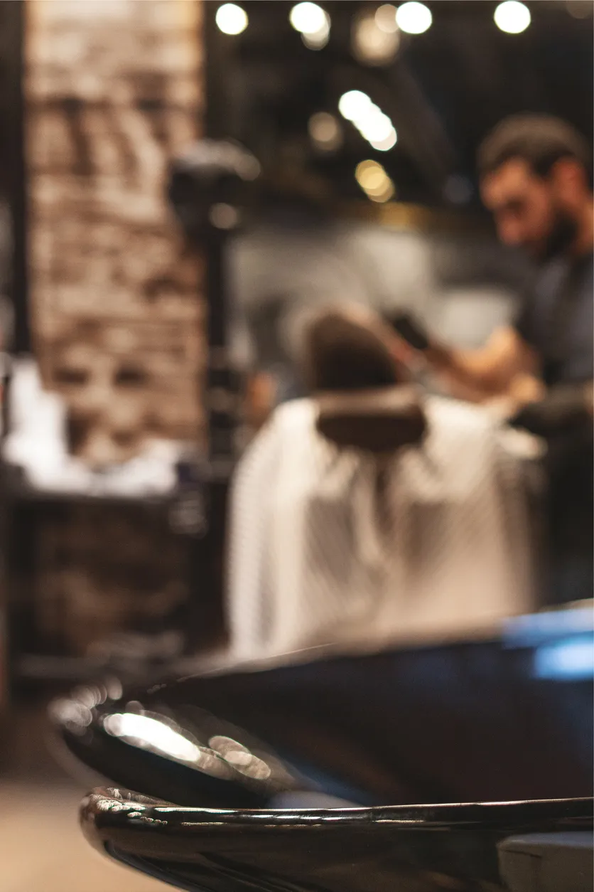 Barber shaping moustache detail at Project Hairway Dubai