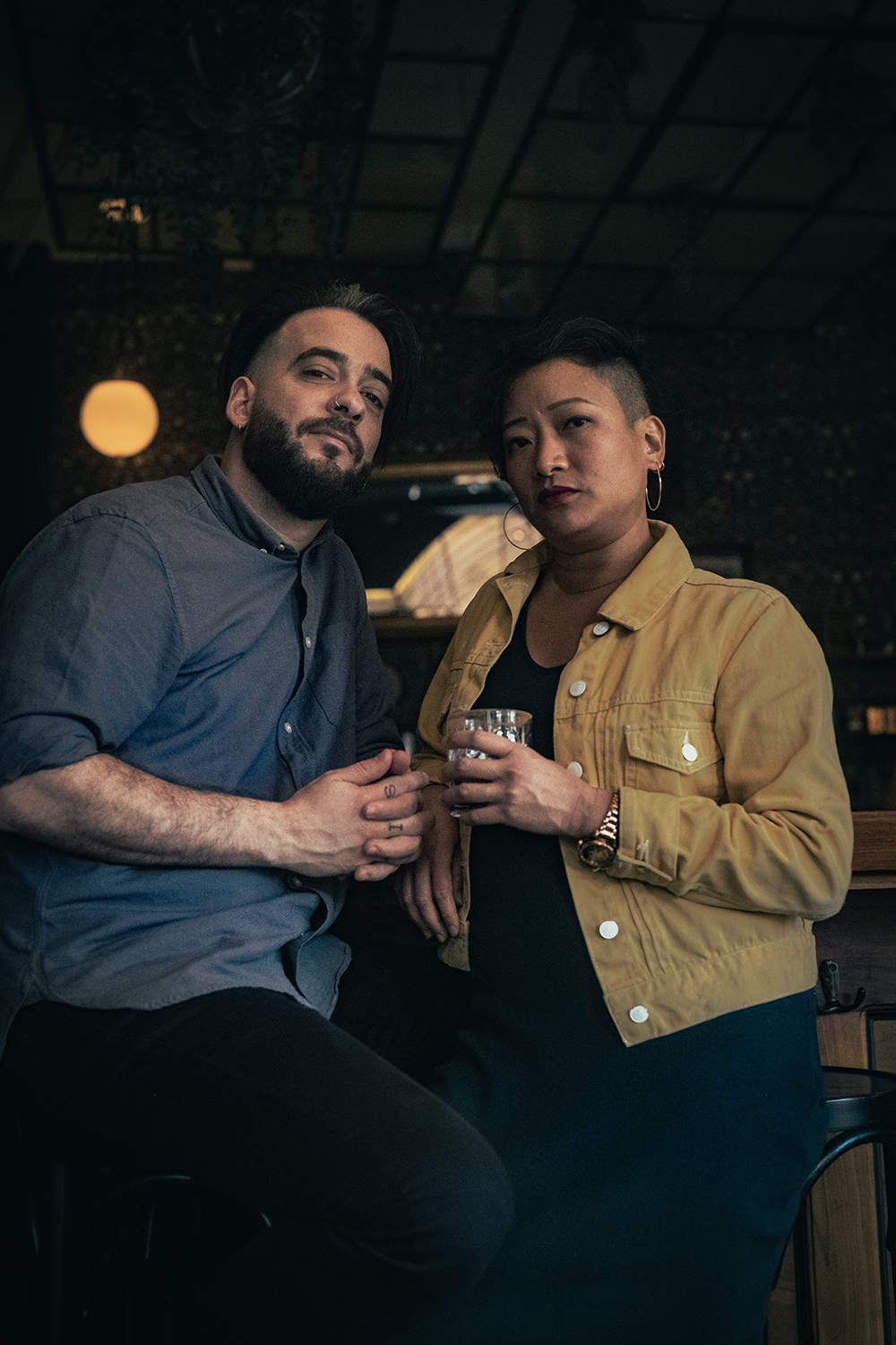 The founders, Elaine and Fábio, looking at the camera on a more serious note, talking about their story.