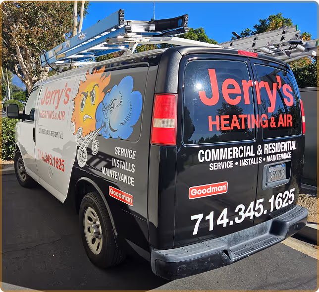 A van advertising Jerry's Heating & Air with company contact information and service offerings painted on the side.