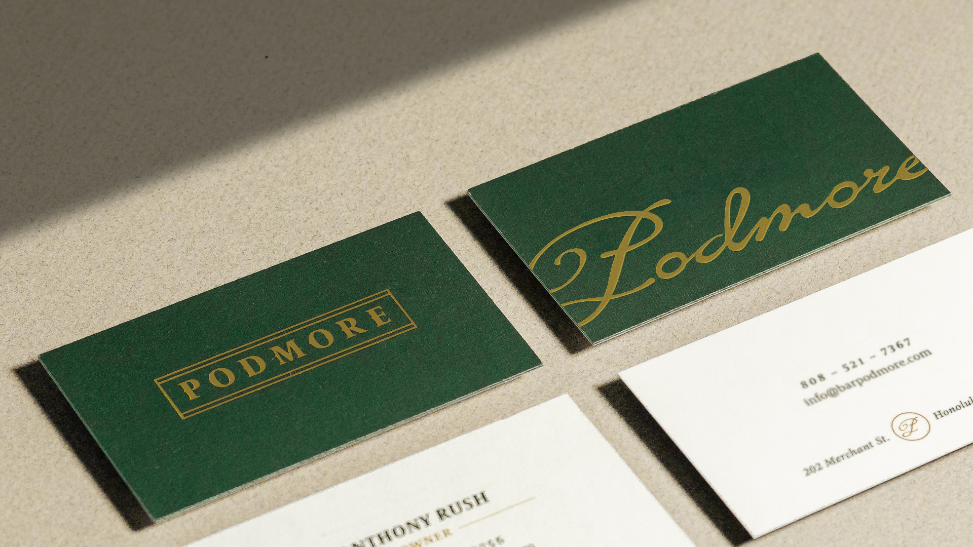 Brand identity, print collateral, and marketing materials designed for Podmore.