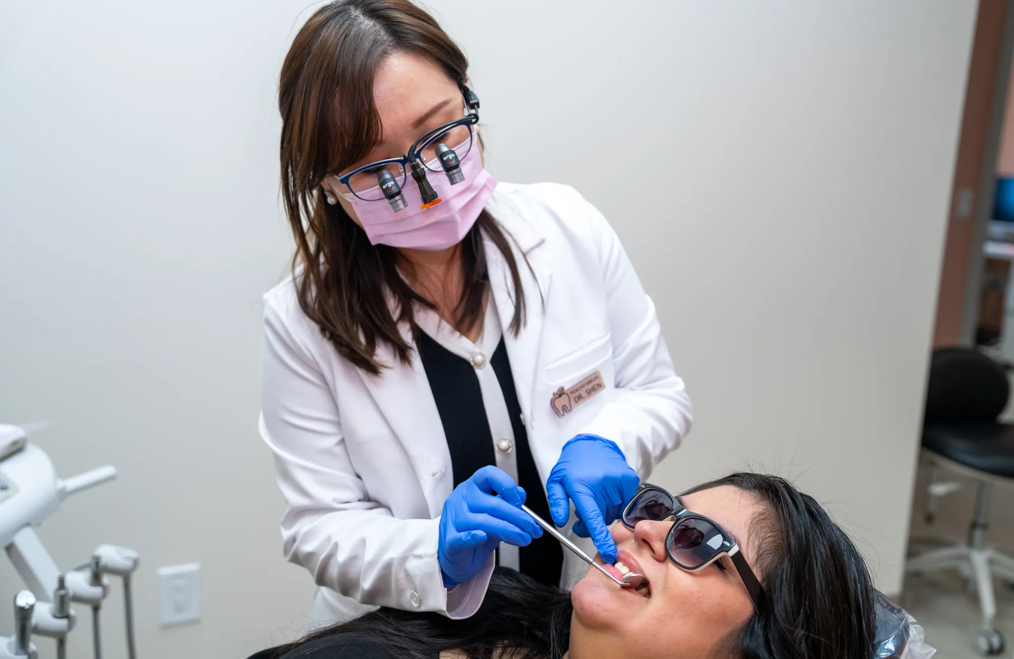 Dr. Shen checking patient