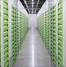 Data center corridor with steel framing and green server racks