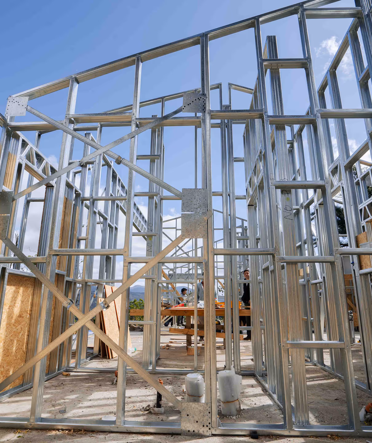 A small residential home's metal wall panel framing