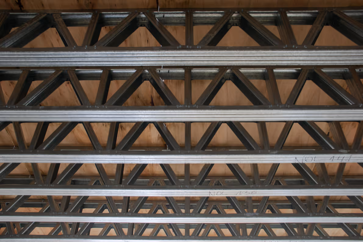 Metal engineered truss structure for building construction