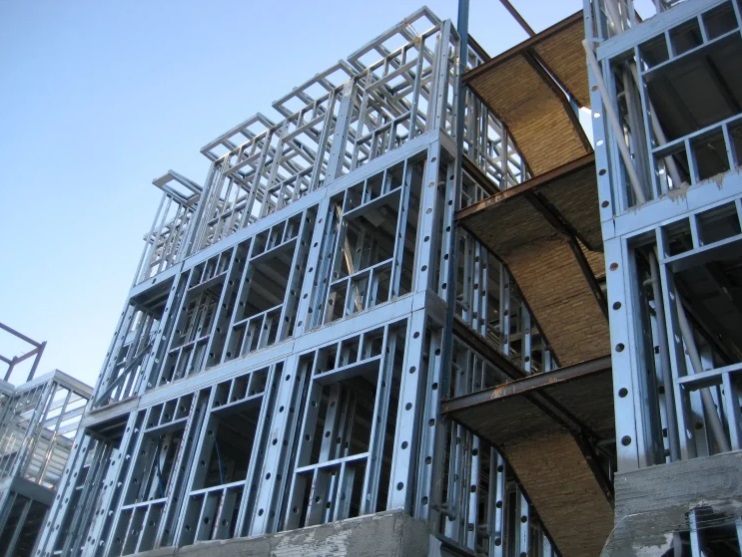Multi-story building framed with load-bearing cold-formed steel walls and floor framing