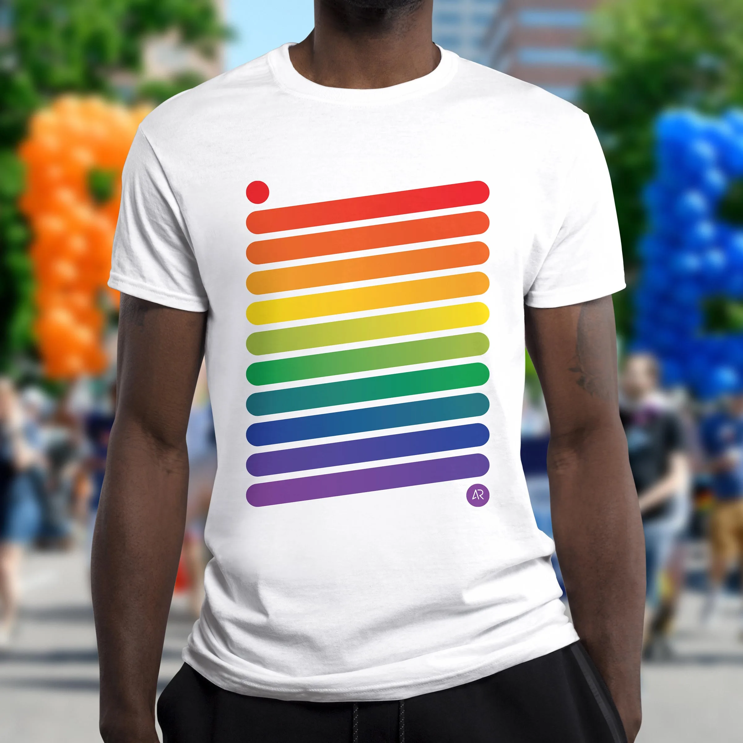 a person at the Denver Pride Parade wearing a white t-shirt with a full-color rainbow print that consist of angled horizontal lines
