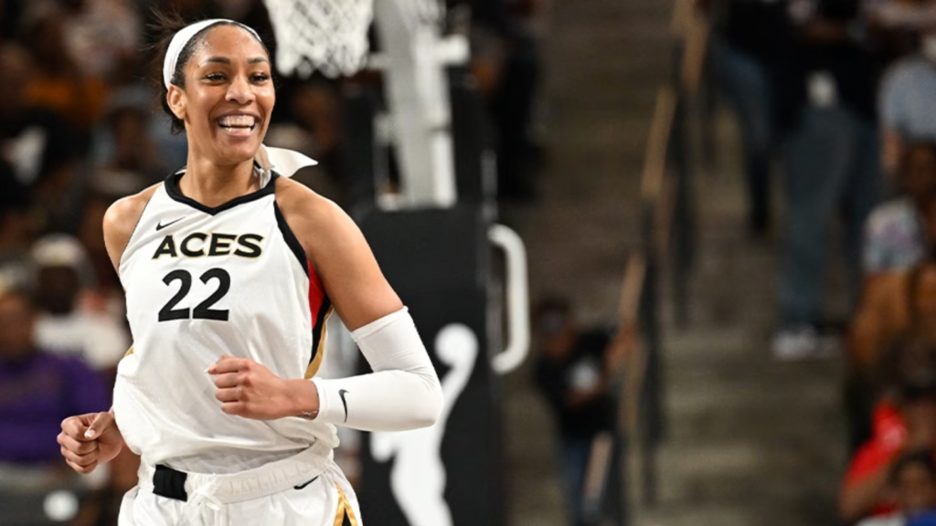 Las Vegas Aces Player A’ja Wilson smiles on the court.