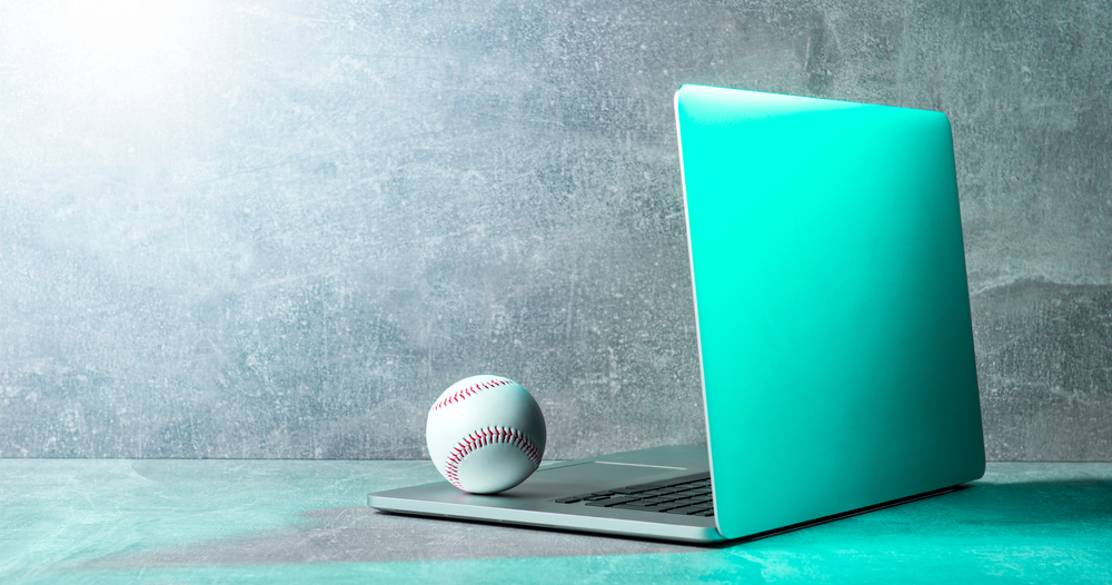 A baseball on a laptop representing sports betting data science