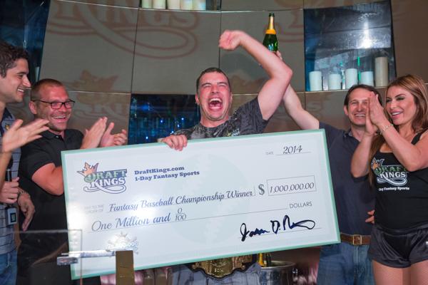 Peter Jennings holding a winning check in 2012