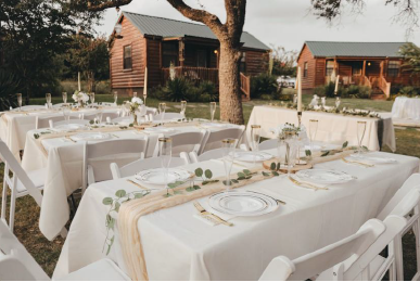 Rustic Texas cabins with green lawn for weddings and family events