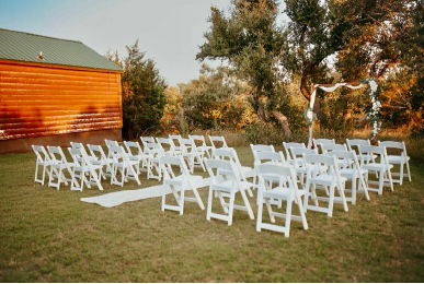 Rustic outdoor wedding seating arrangement at Texas cabins