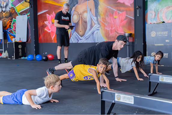 Kids doing exercises with the coach