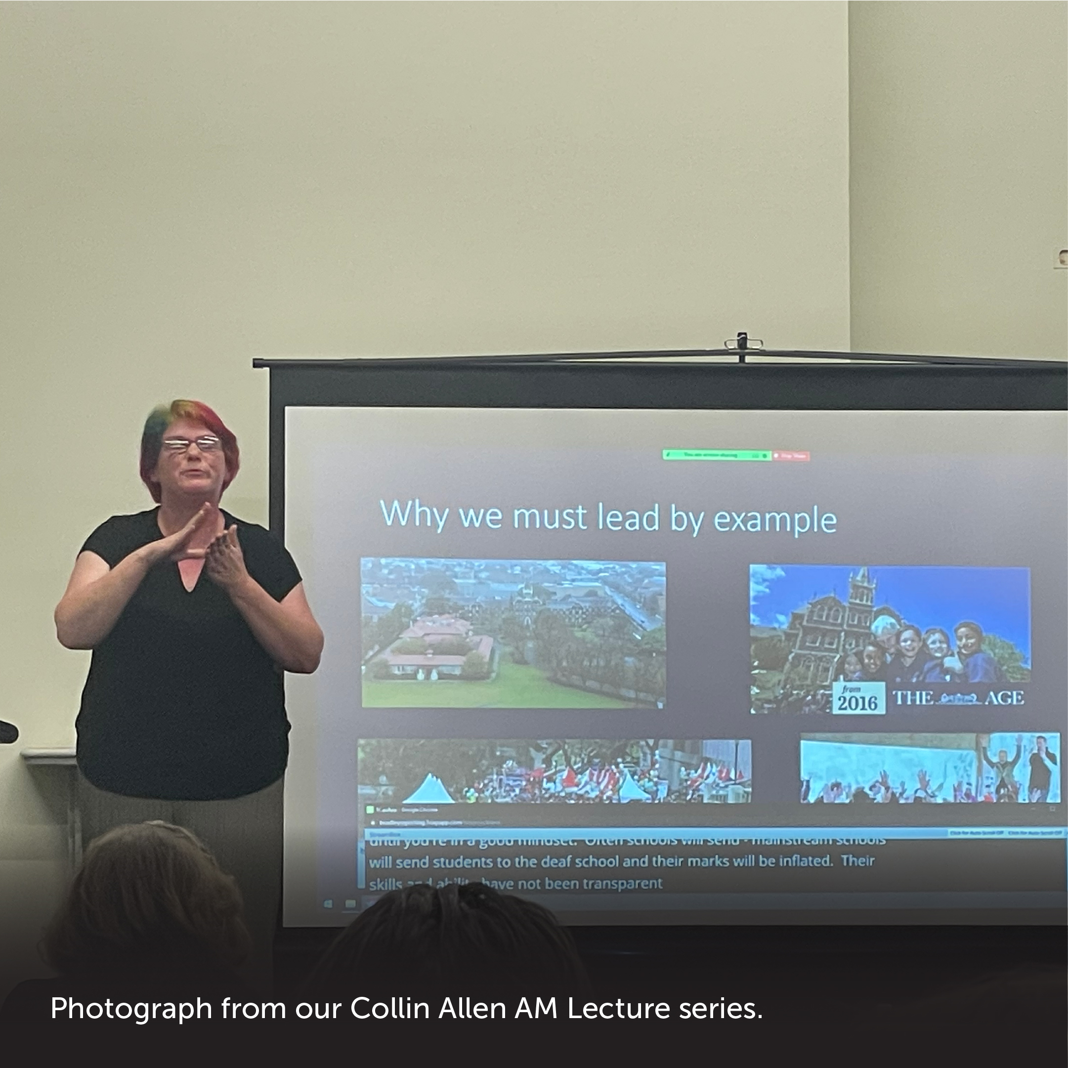 Slide 8: Photograph with caption at the bottom. Person on stage signing during the Collin Allen AM Lecture series. Caption: 'Photograph from our Collin Allen AM Lecture series.'