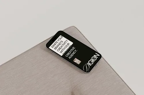 A close up of a cell phone on a table.