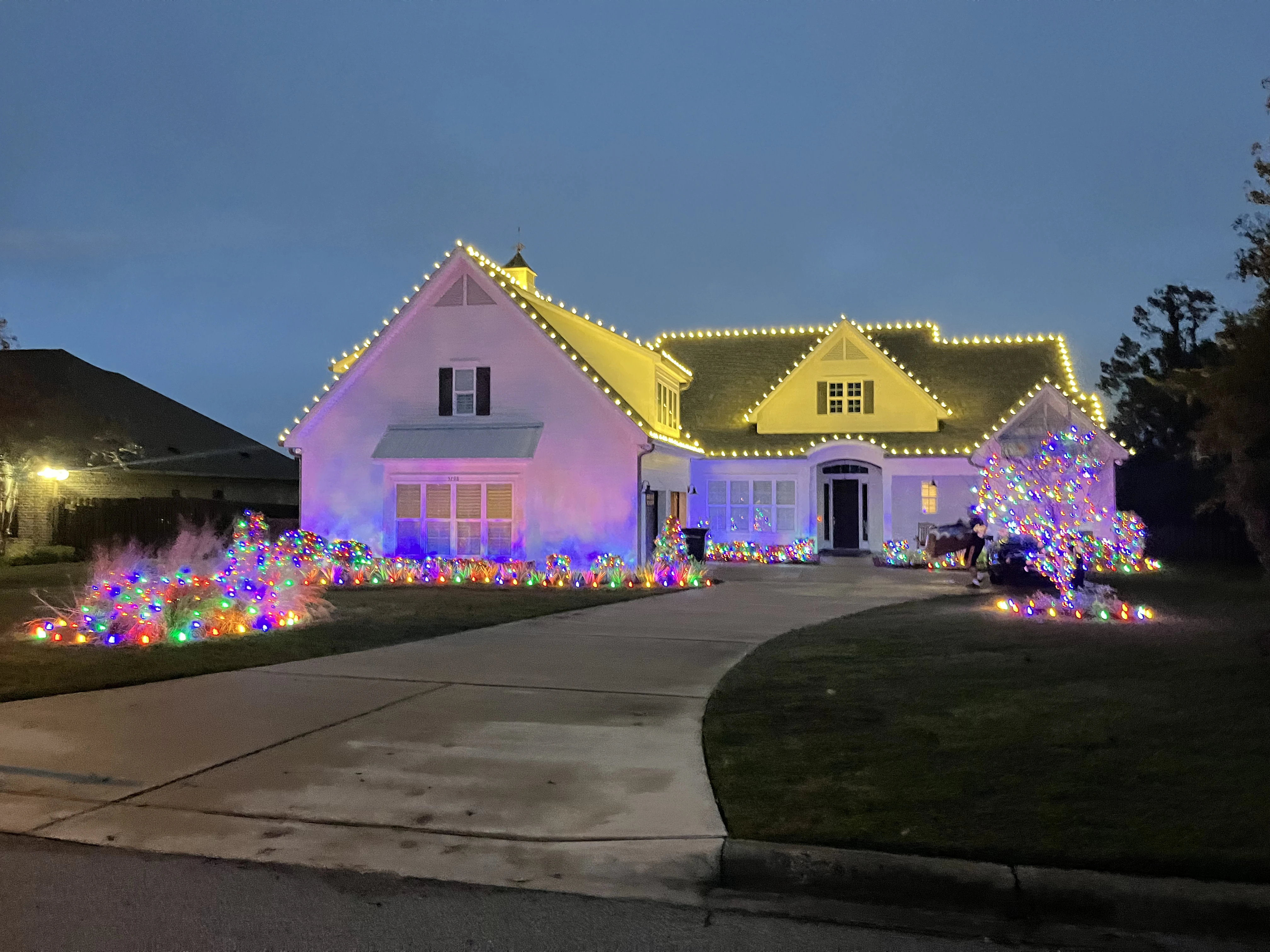 An image of house with different color of decorated lights.