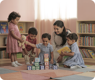 Children learning honesty and responsibility while using toys and books in a preschool library