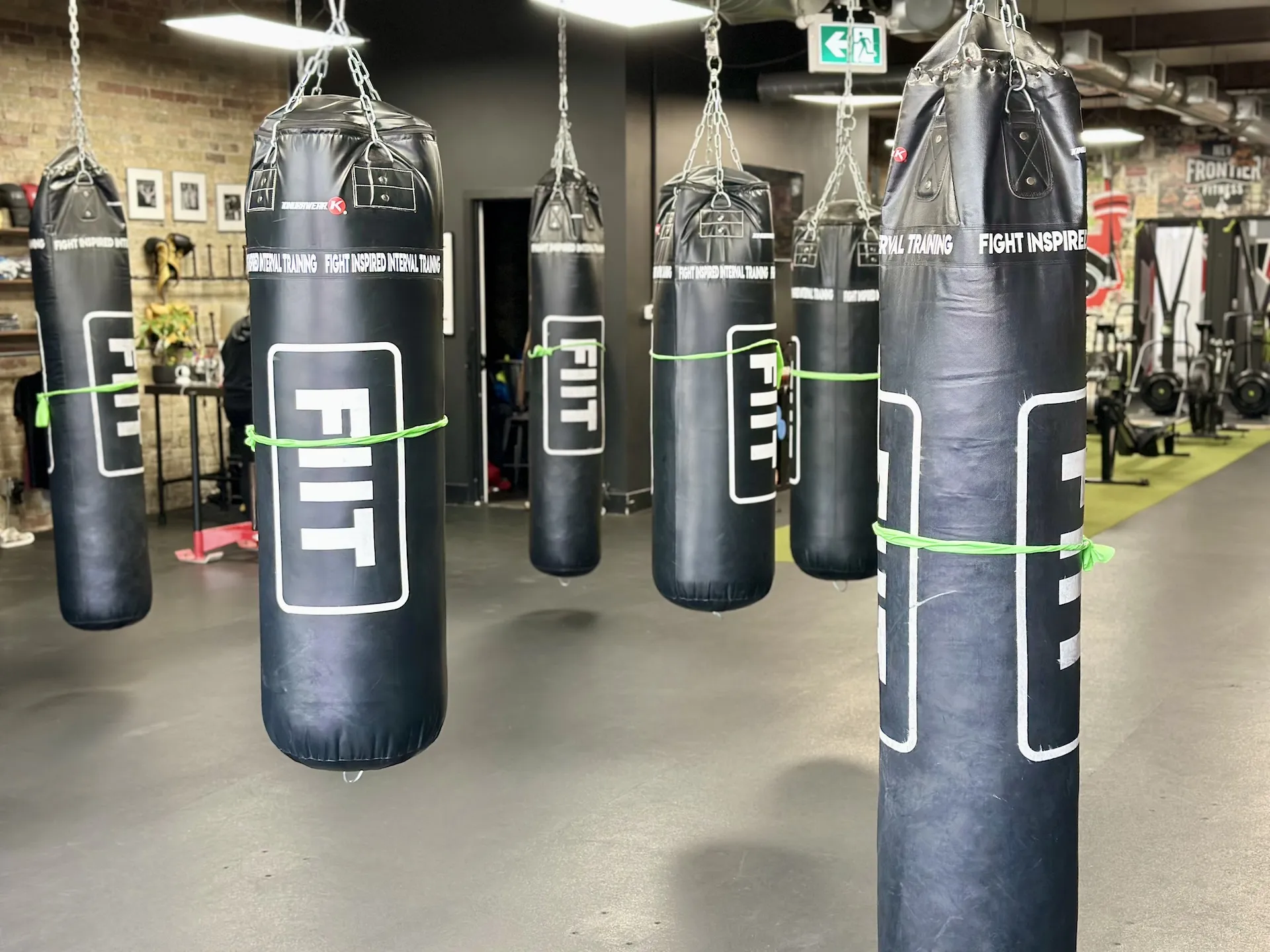 Boutique Boxing Studio with FIIT punching bags hanging from ceiling