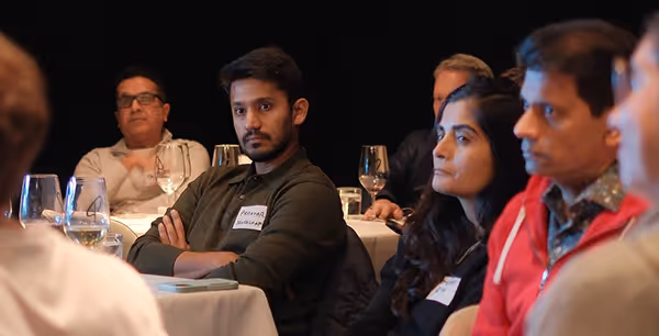 Group of startup founders networking during a Gild event