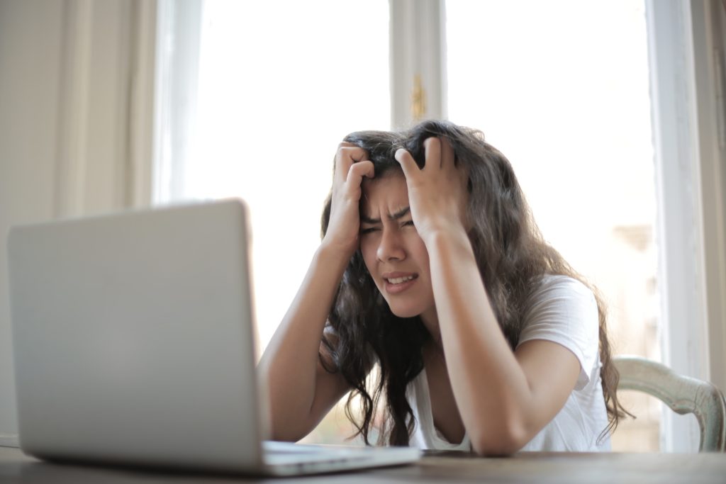girl frustrated on her laptop