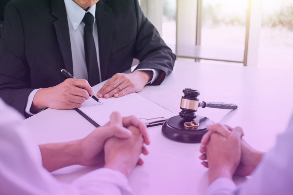 Couple reviewing financial documents while dividing assets