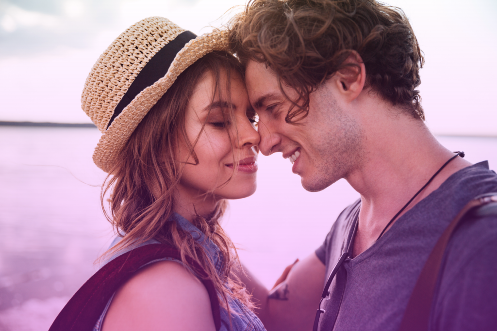 Couple Sharing Smiles by the Ocean