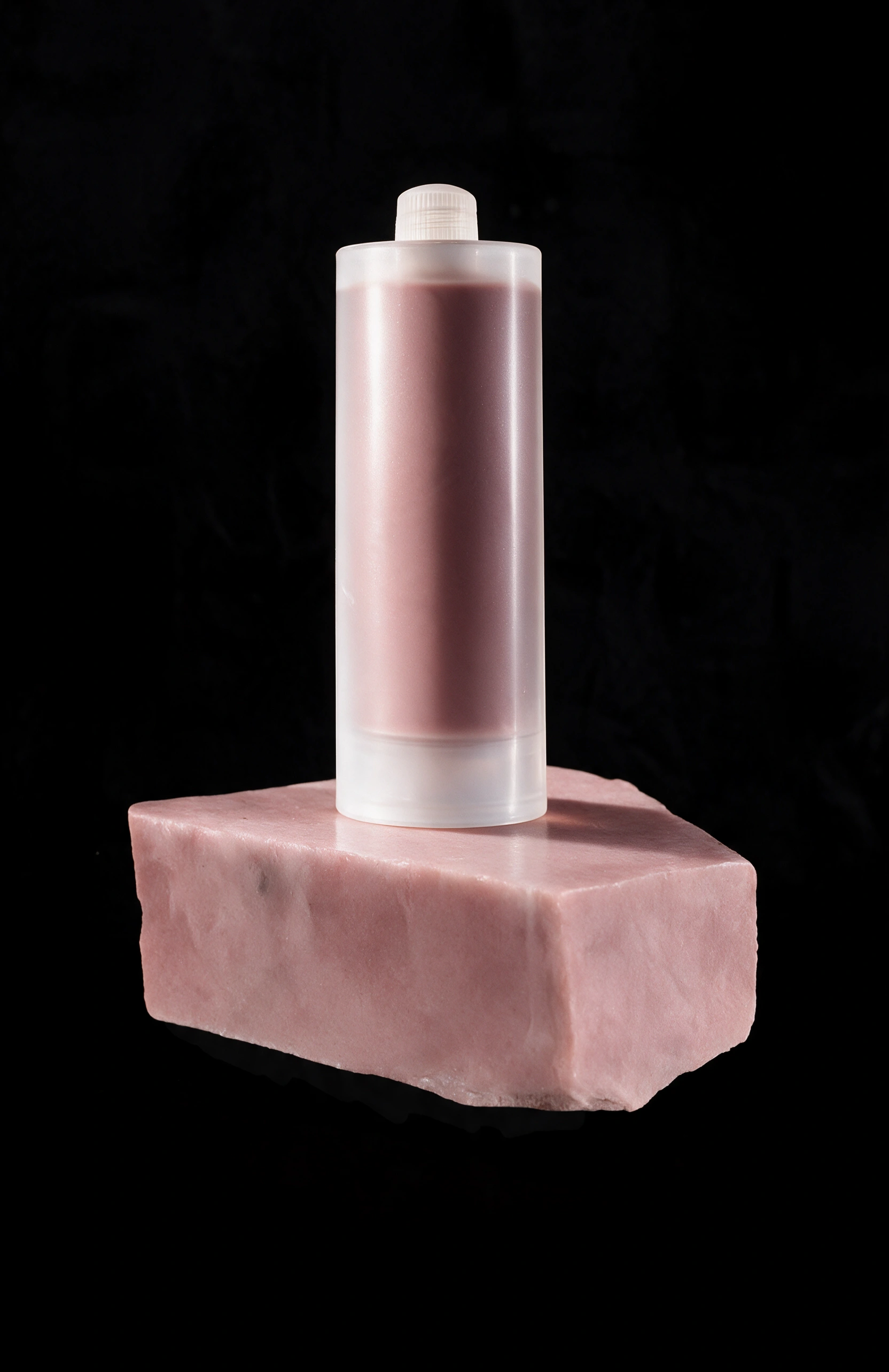 Pink FugeMads cartridge standing on a matching pink stone block