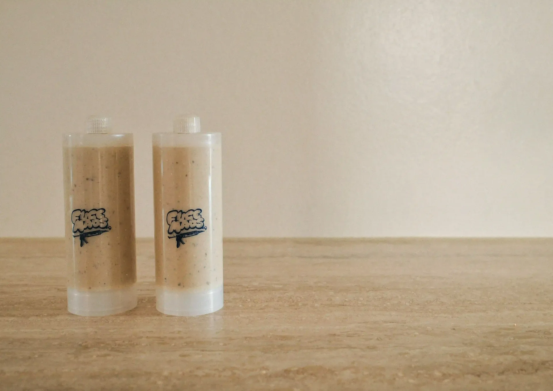 Two Stone Echo veined silicone sealant cartridges matched to Travertine limestone countertop