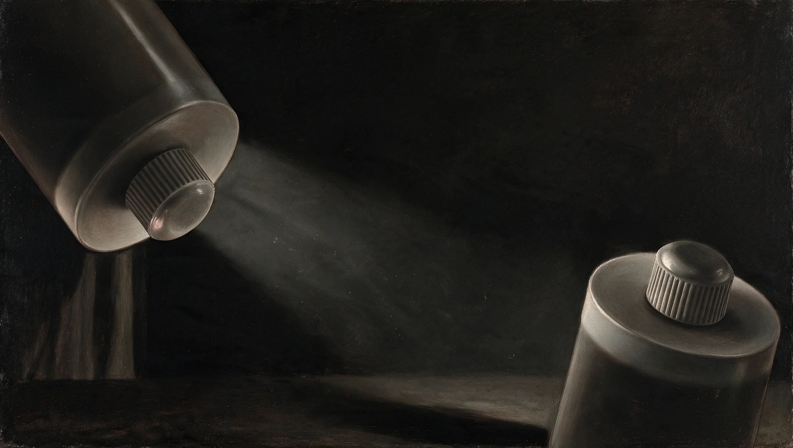 Two FugeMads silicone cartridges floating over a dark stone slab