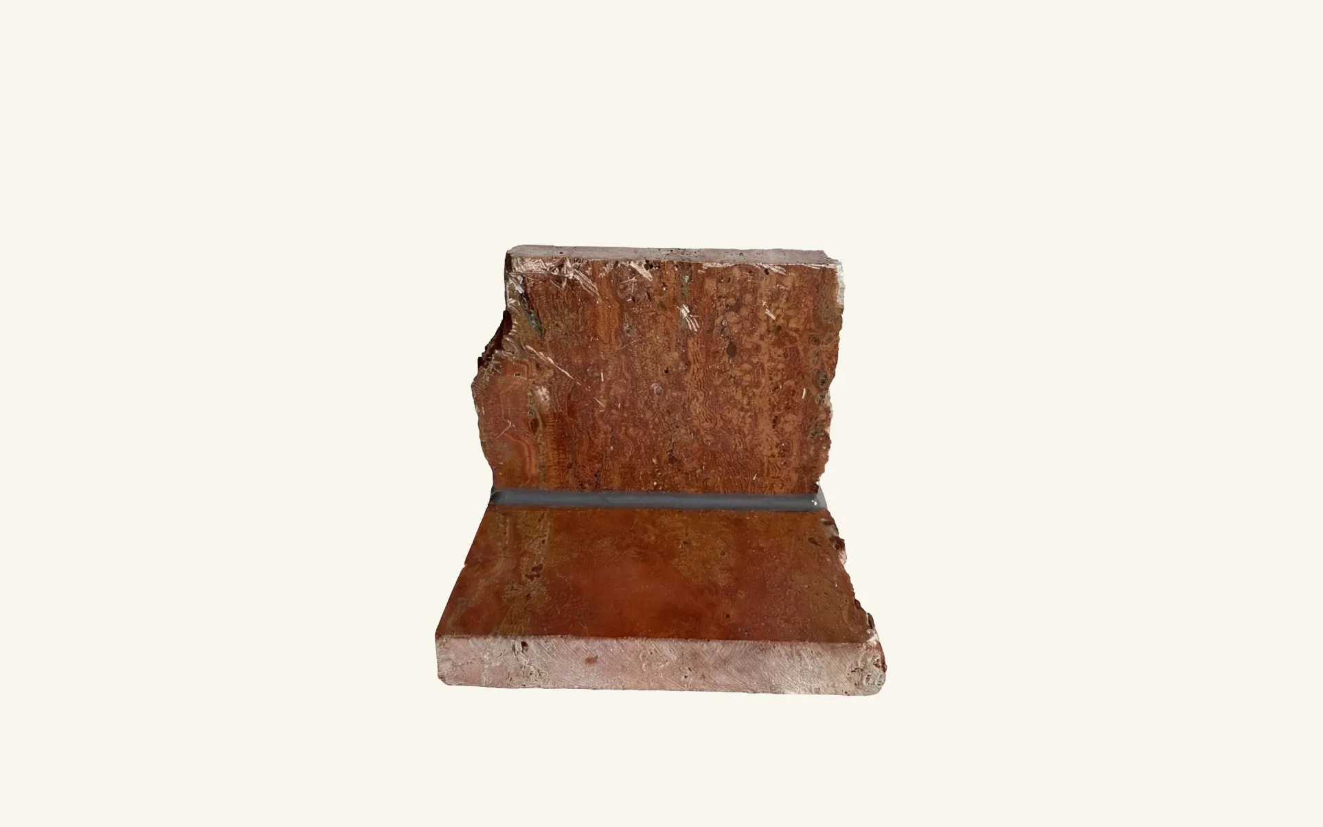 Rosso travertine surface featuring FugeMads Stone Echo veined silicone sealant