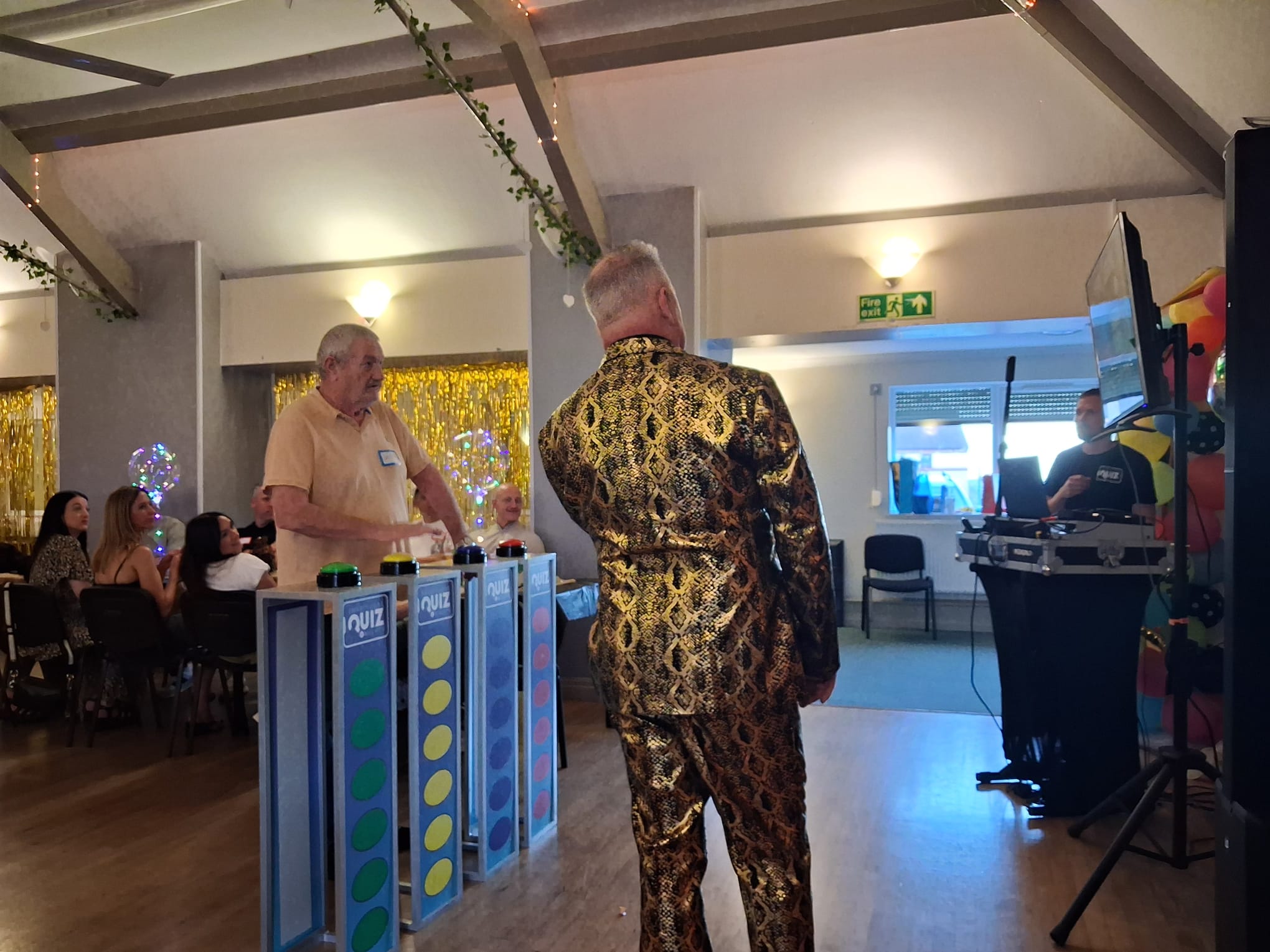 Corporate live game show experience with podiums and buzzers