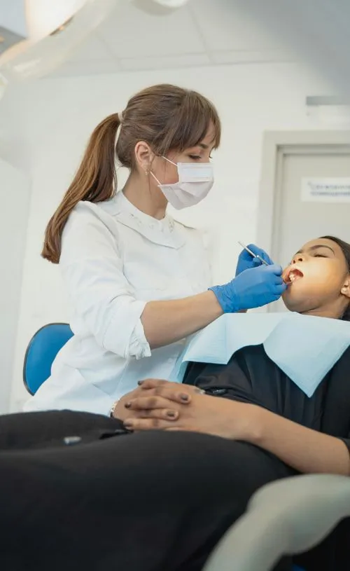 Lady Dentist Treating
