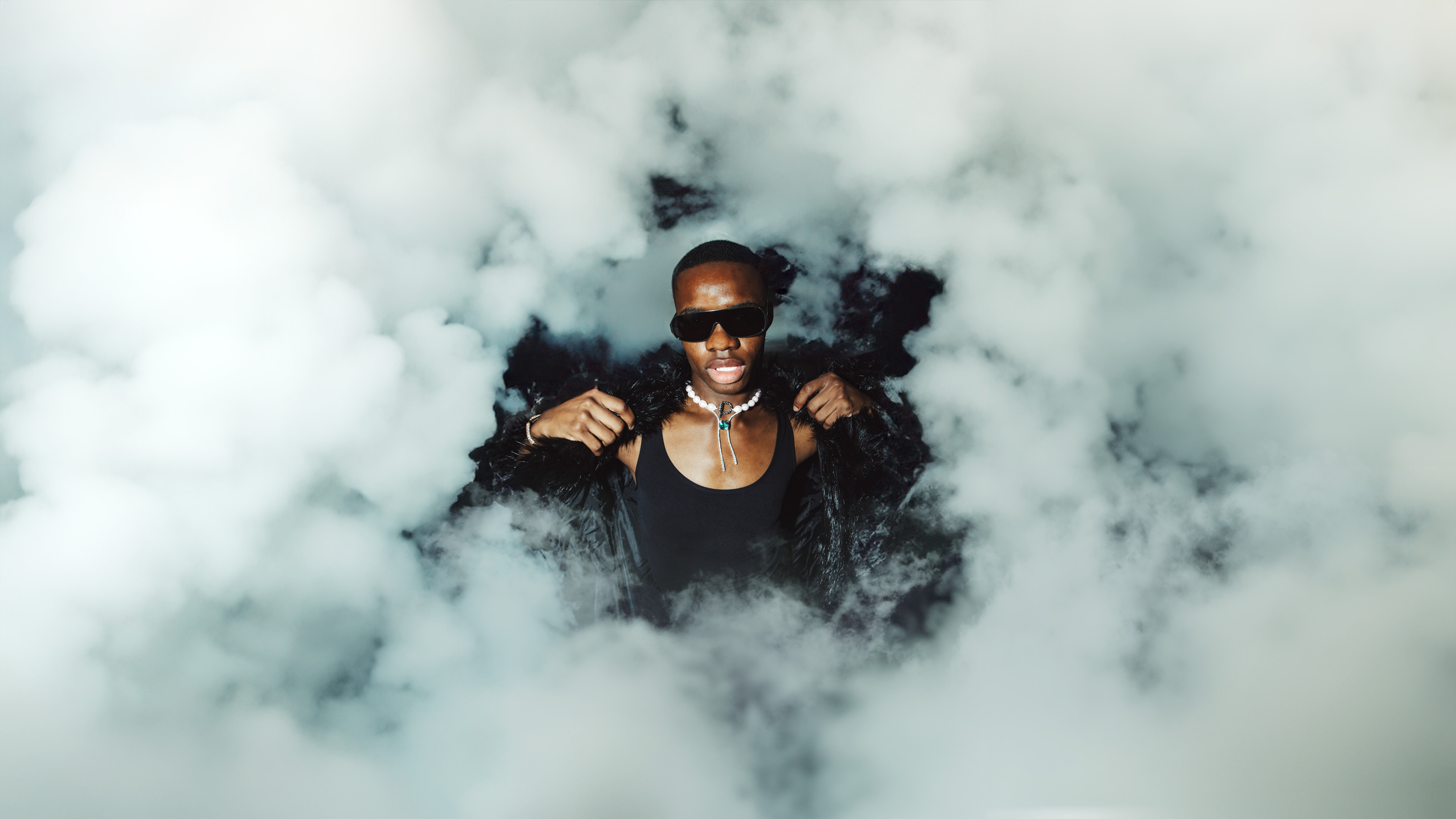 black Male Model in a Cloud with jewellery on his neck