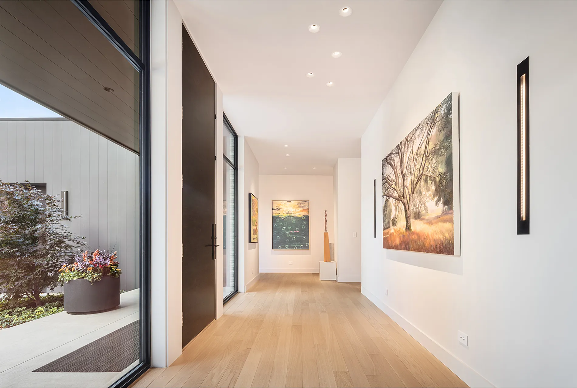 modern light hallway with light wood floors