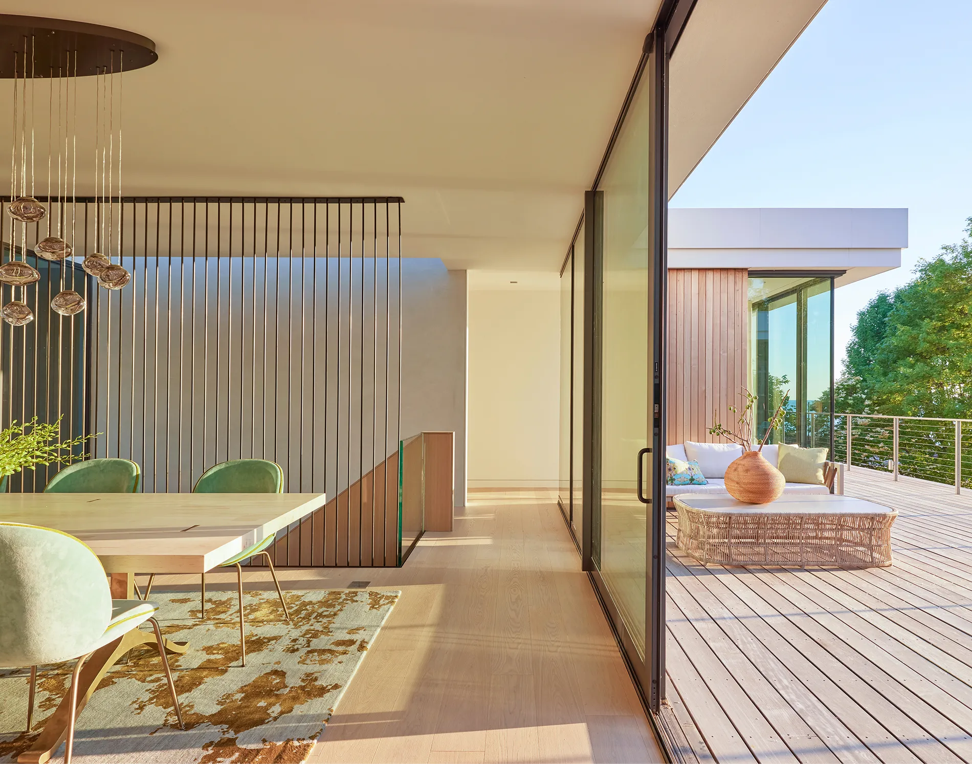 Ultra-modern home with light hardwood floors and open sliding doors