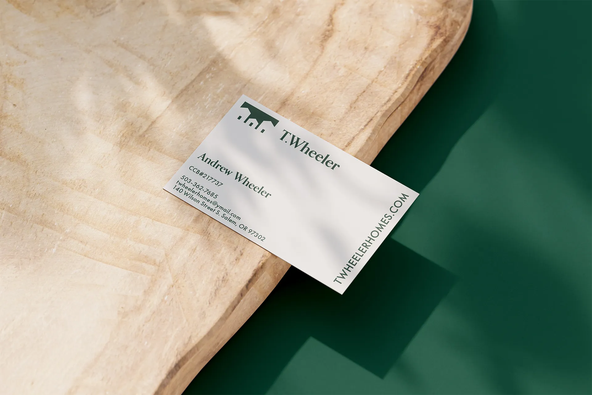 Business card for Andrew Wheeler of T.Wheeler with contact info and twheelerhomes.com website.