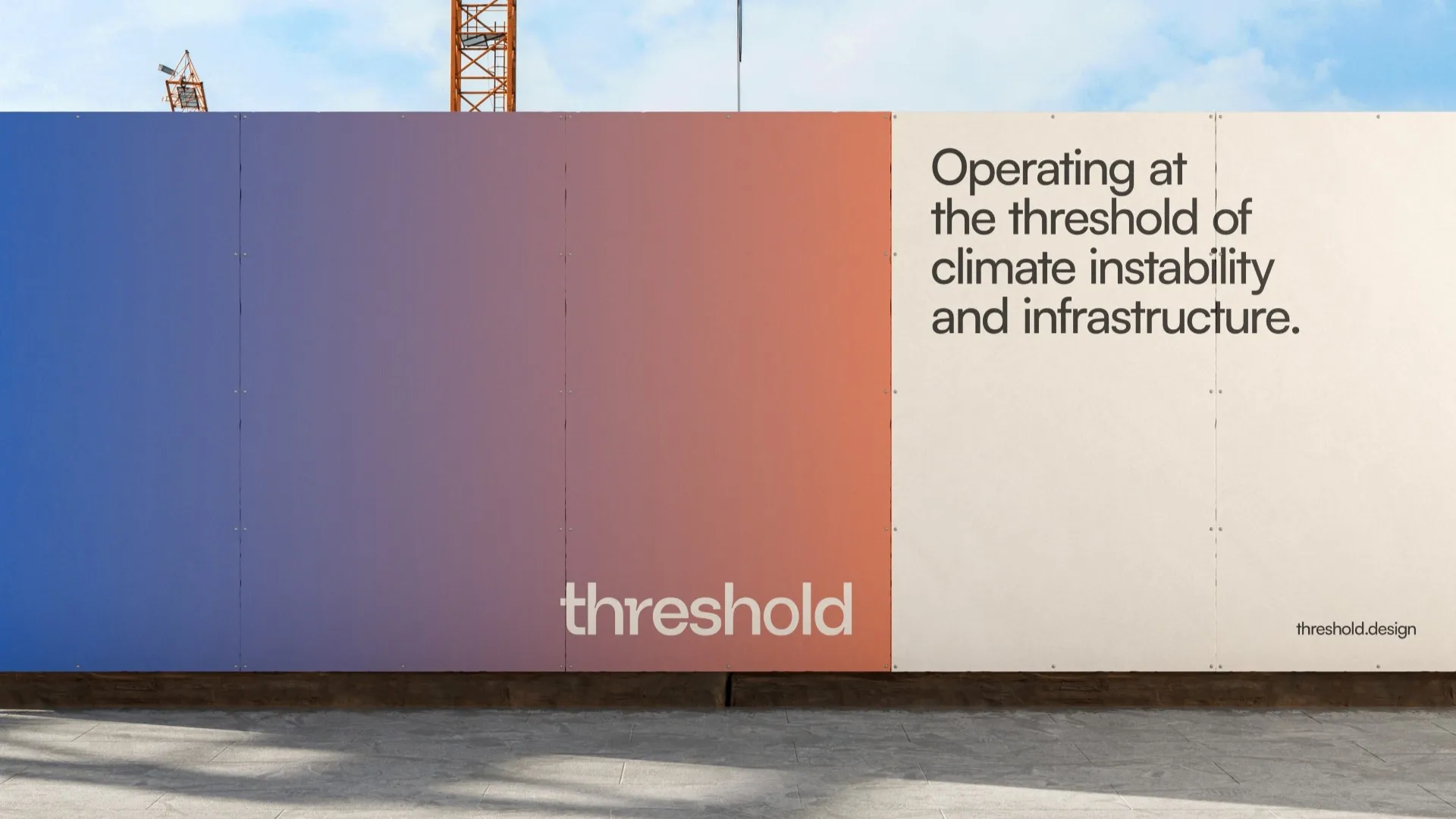 Construction barrier with gradient colors and text about climate instability and infrastructure.