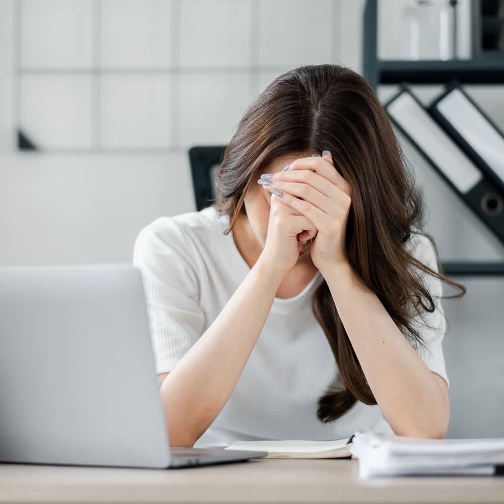 Frustrated Woman at Desk