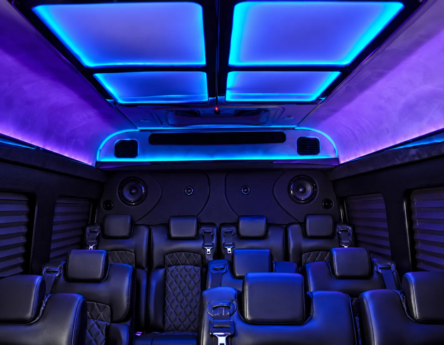VANTA BLK Sprinter black leather seats beneath blue ambient ceiling lighting