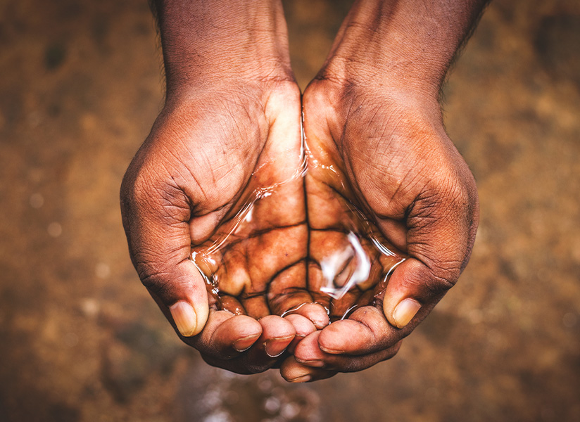 Cupped hands holding clean water
