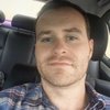 A man inside a car.