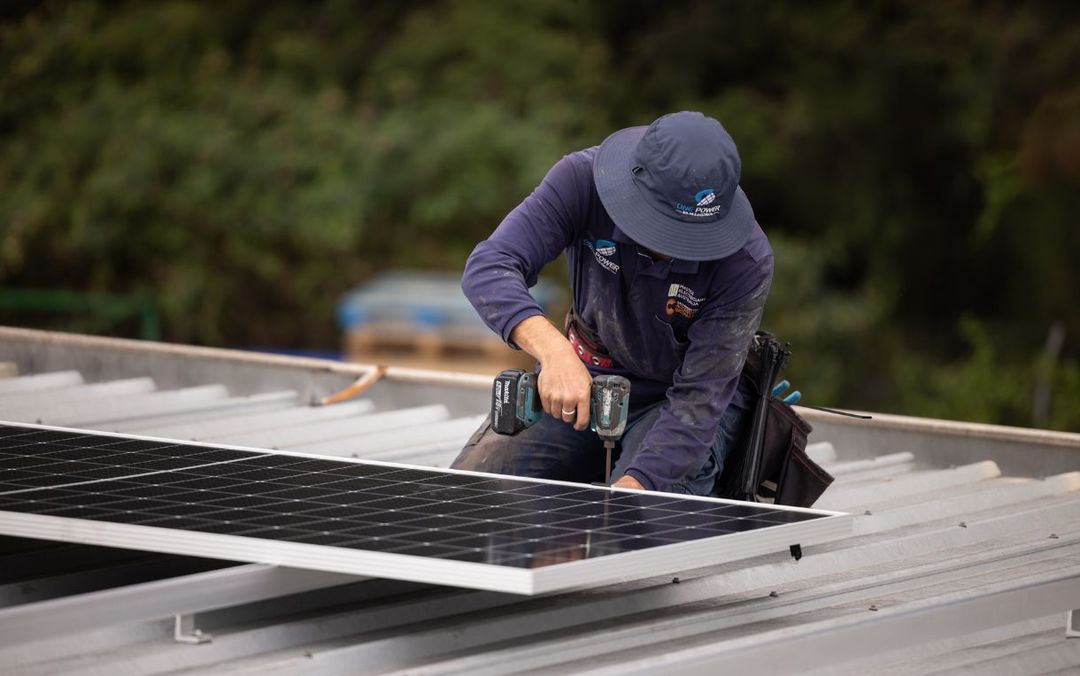One Power Solar installer fitting panels