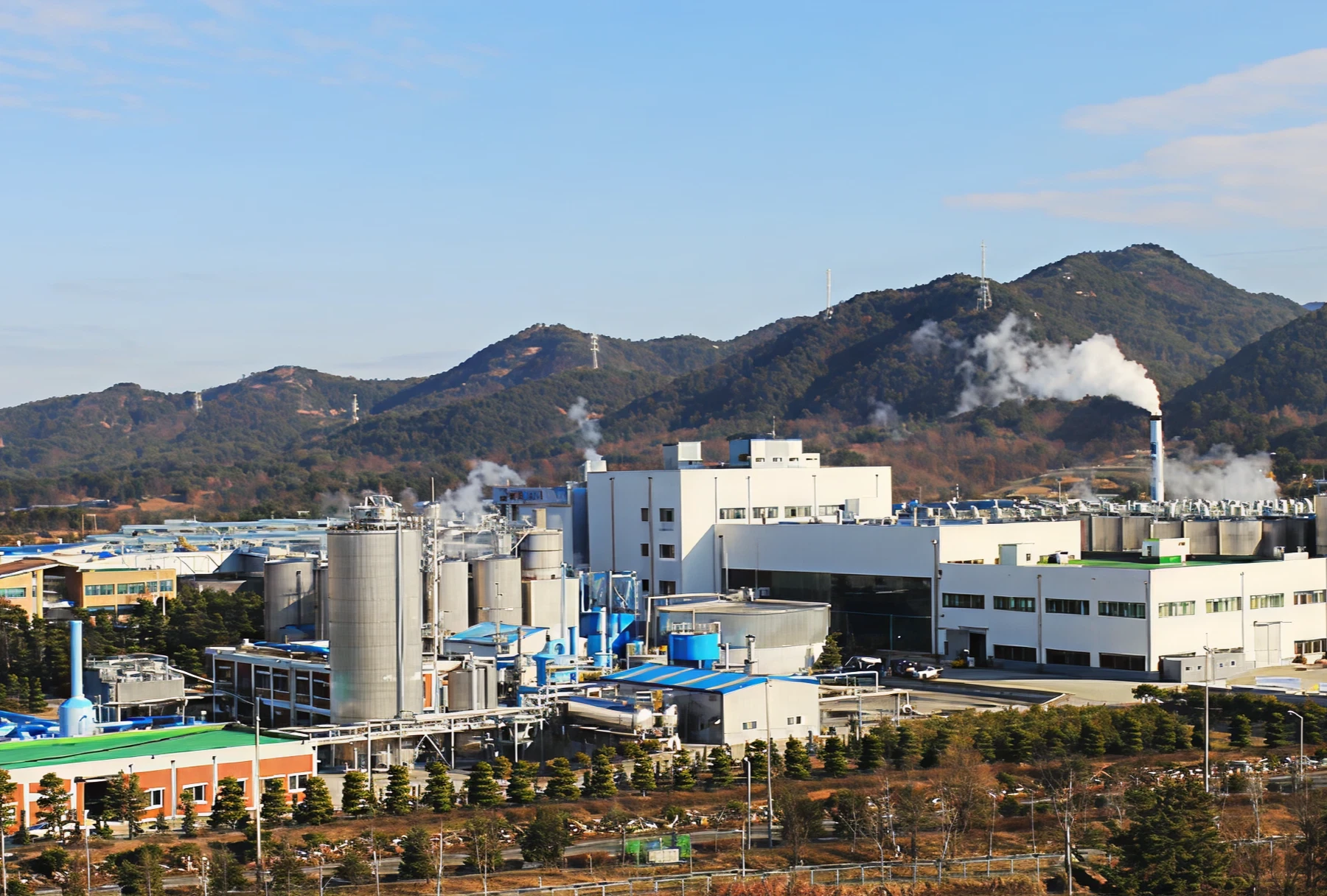 Industrial plant with mountains in background