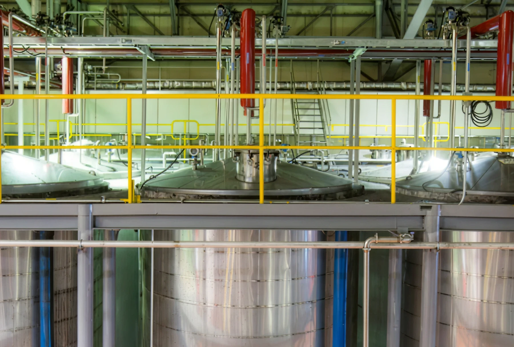 Stainless steel fermentation tanks in factory interior