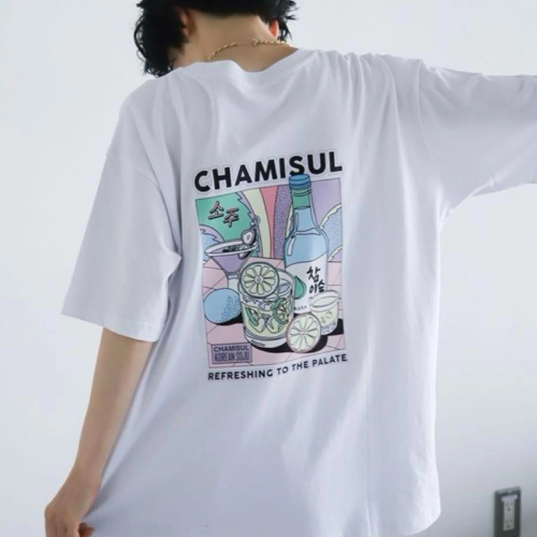 Person wearing white Chamisul soju graphic t-shirt