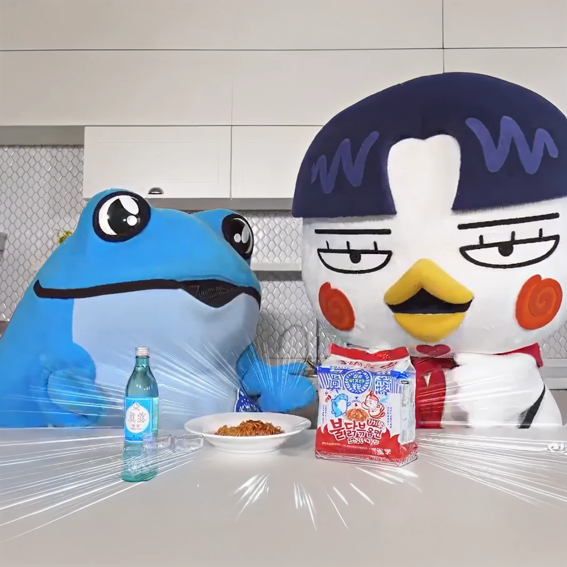 Blue frog and bird mascots sharing noodles