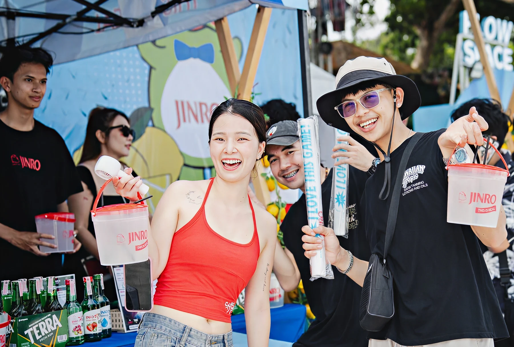 People enjoying JINRO booth at outdoor event