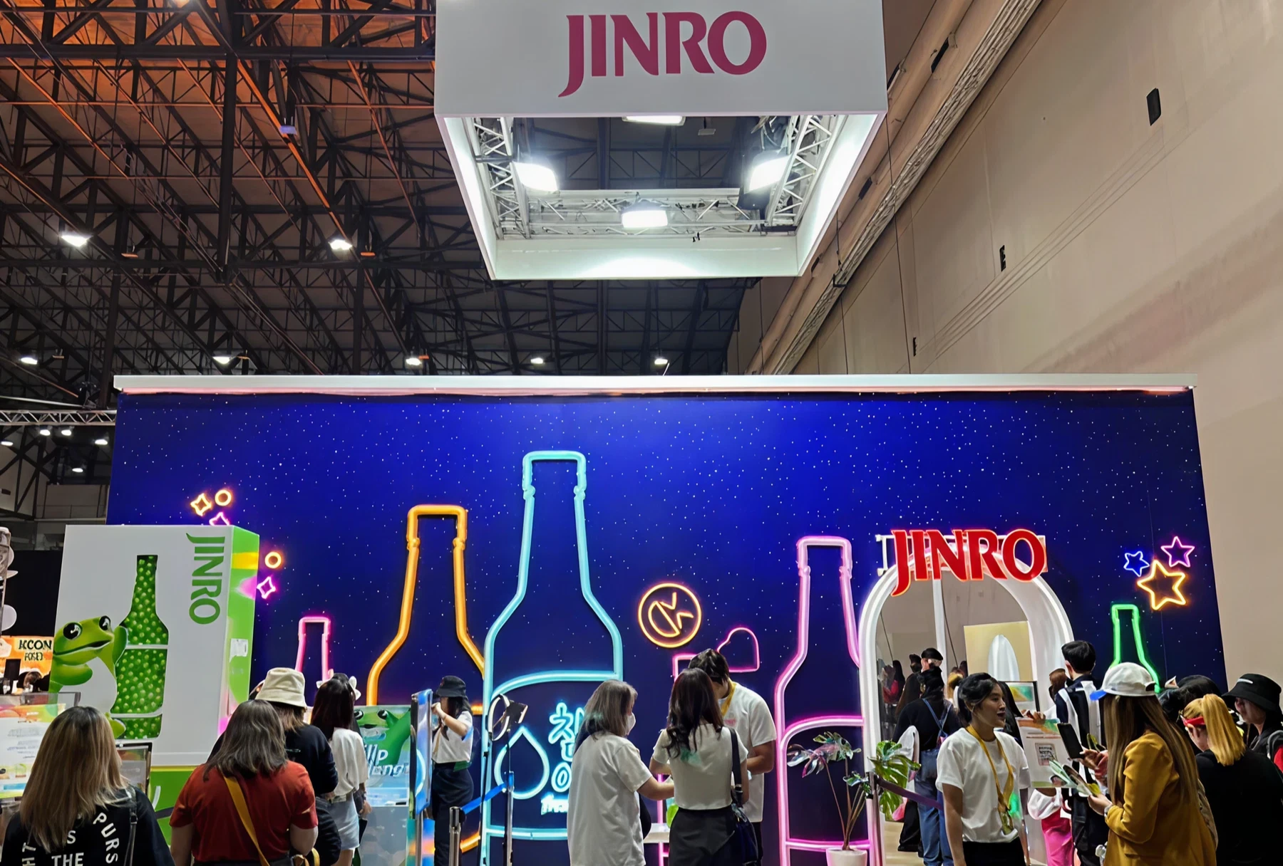 JINRO exhibition booth with neon bottle designs.