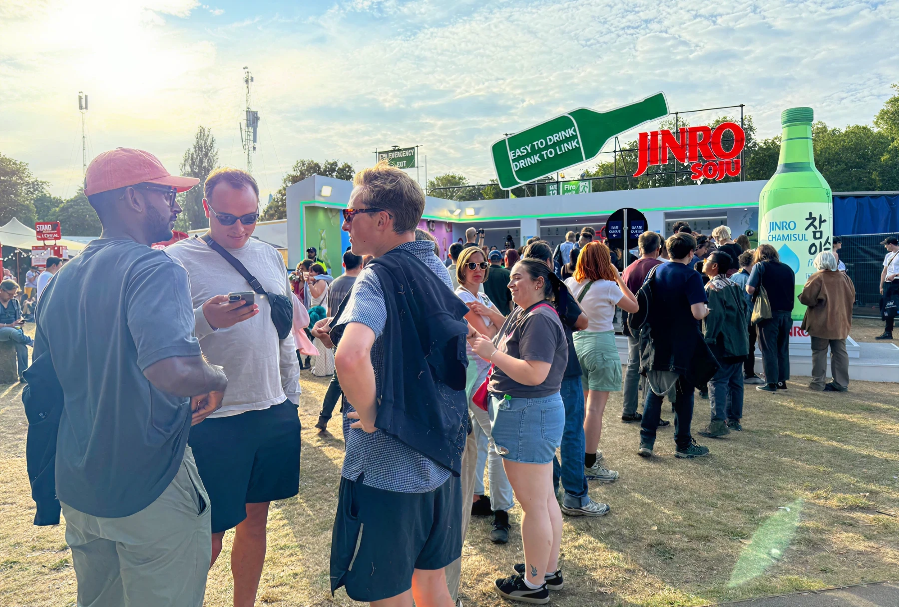 People gathered at the JINRO Soju booth outdoors.