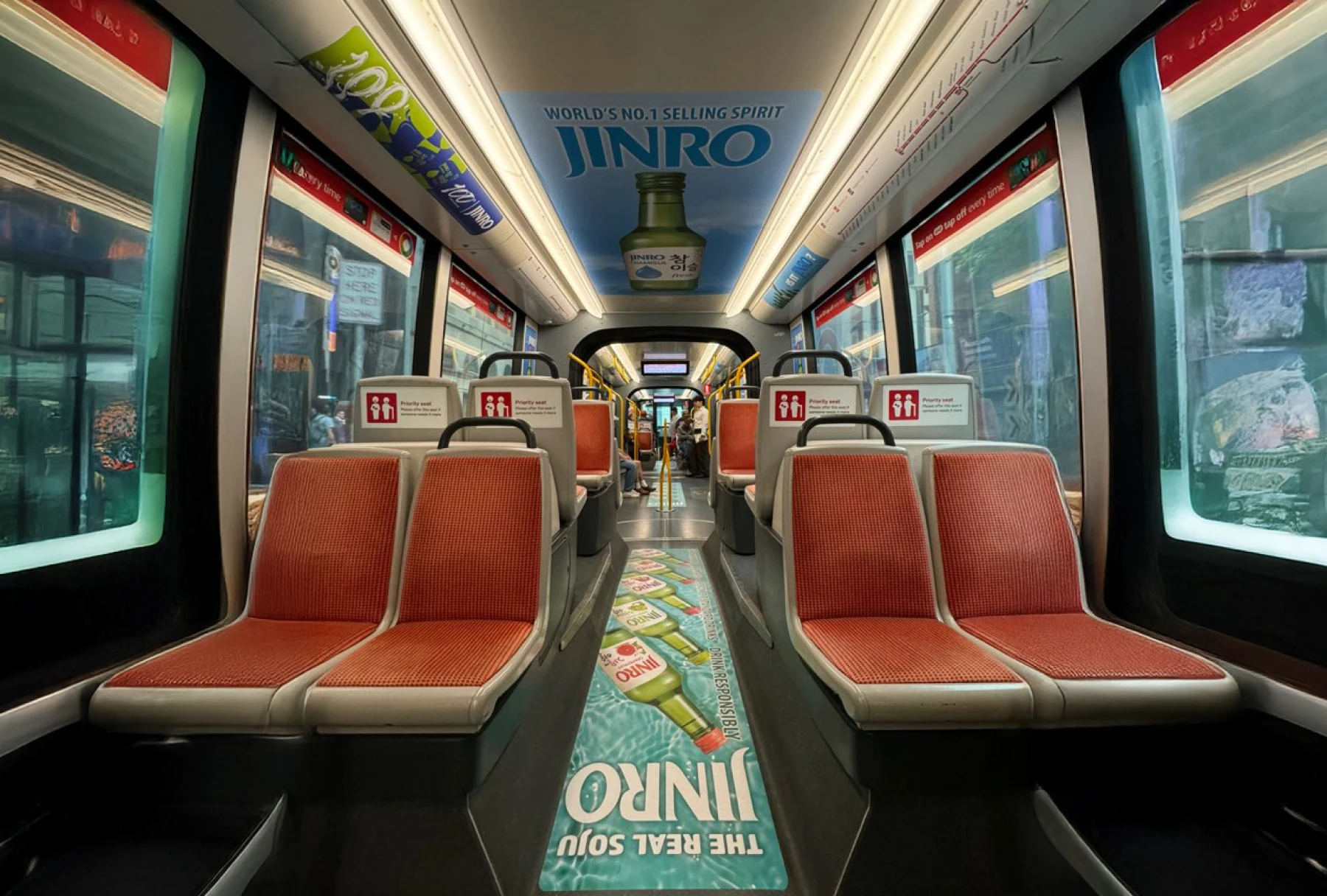 Train interior with JINRO Soju advertisements.